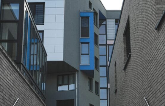 gray concrete building with blue windows