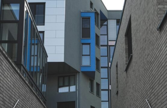 gray concrete building with blue windows
